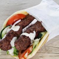 Ground Beef Kabob Wrap · Lettuce, onions, tomatoes, cucumbers, tzatziki and feta cheese, olives wrapped with pita bre...
