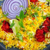 Hyderabadi Chicken  Biryani · The chicken is sandwiched between layers of fragrant long-grained basmati rice, and cooked o...