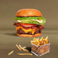 Break Of Dawn Burger · American beef patty topped with turkey bacon, fried egg, avocado, melted cheese, lettuce, to...