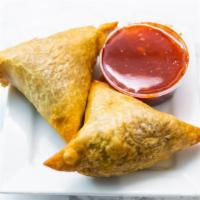 Samosa · Unusual twist by our chef's favorite well-seasoned potato and peas wrapped in flaky pastry s...