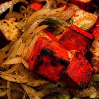 Lasooni Paneer Tikka · Paneer tikka made from chunks of paneer marinated in spices and grilled in a tandoor.