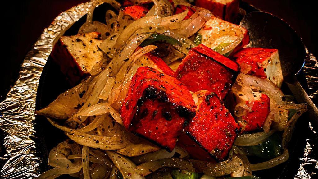 Lasooni Paneer Tikka · Paneer tikka made from chunks of paneer marinated in spices and grilled in a tandoor.