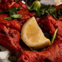 Tandoori Chicken · Chicken with bone marinated in yogurt, garlic, and very mild Indian herbs.