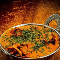 Butter Chicken · Marinated chicken cooked in a mild creamy curry sauce along with spices.