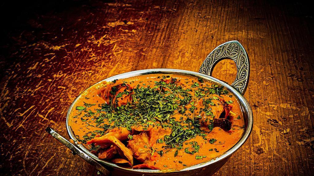 Butter Chicken · Marinated chicken cooked in a mild creamy curry sauce along with spices.