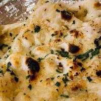 Garlic Naan · Traditional white soft bread with garlic and cilantro.