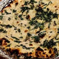 Jalapeno Cheese Naan · Traditional white soft bread stuffed with cheese and jalapeno.