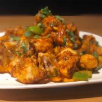 Aloo 65 · Potato cubes dipped in spiced batter, deep-fried and tossed with curry leaves in a spicy yog...