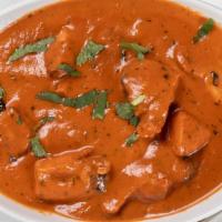 Butter Chicken · Chicken marinated in yogurt and spices, cooked in tomato purée and cream.