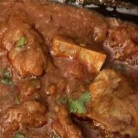 Goat Curry · Goat (on the bone) cooked in a traditional blend of spices and herbs.