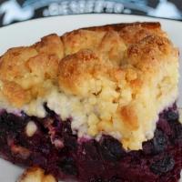 Blueberry Pie · All butter crust filled with gooey blueberries and topped with a sweet ginger streusel