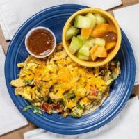 Migas Mexican Scramble · Two eggs scrambled with pork sausage, fried tortilla chips, jalapeño, onions, tomatoes, and ...