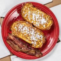 Classic French Toast Breakfast · Two thick-sliced pieces of french bread dipped in our homemade maple-almond batter, grilled ...