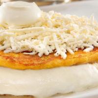Cachapas · Come with soft white chesse, cream and shredded chesse.