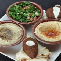 Veggie Sampler · A variety of vegetarian delights such as hummus, Baba Ghanouj, Tabouli and Falafel. Served w...
