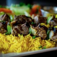 Beef Kabob · Two skewers of chargrilled beef kabobs with bell peppers and onions.