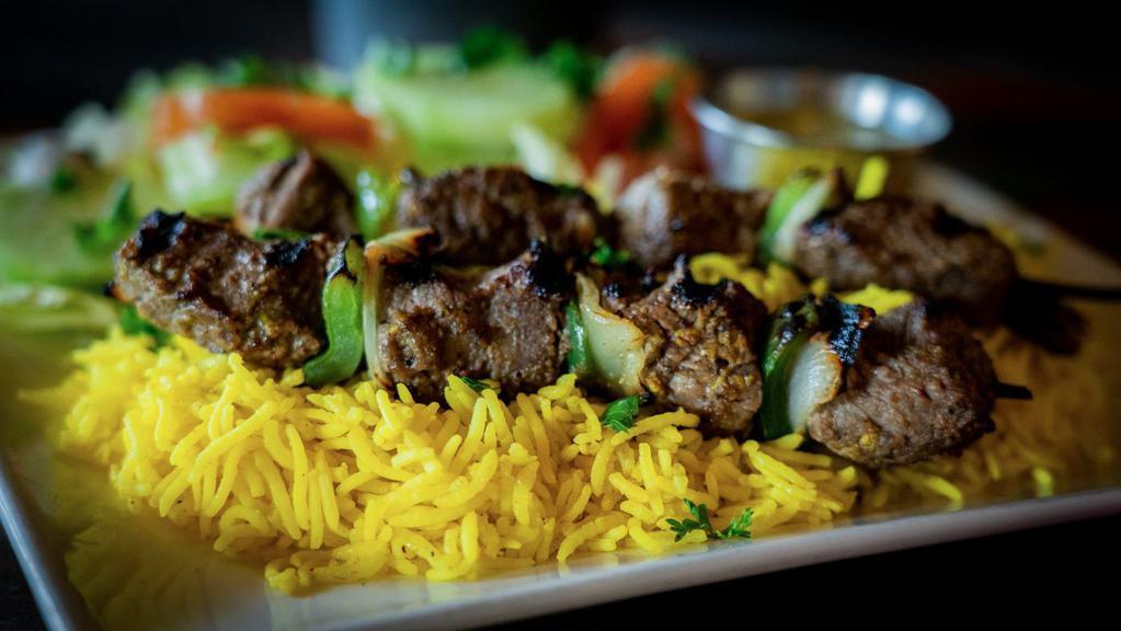 Beef Kabob · Two skewers of chargrilled beef kabobs with bell peppers and onions.