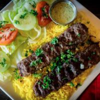 Beef Kafta · Two skewers of ground beef kafta blended with onions and special herbs.