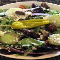 Greek Salad · Organic spring mix with tomatoes, red onions, Kalamata olives, cucumbers, feta cheese and pe...