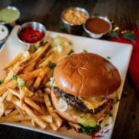 Blazing Hot Burger · Chargrilled burger served on a bun with cheese, lettuce, sautéed onions, tomatoes, pickles, ...