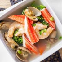 Seafood Soup · Shrimp, crab stick, scallop, mussel, and vegetables in clear broth.