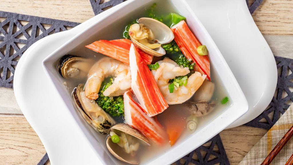 Seafood Soup · Shrimp, crab stick, scallop, mussel, and vegetables in clear broth.