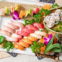 Sushi (For 2) · Chef’s choice of 16 pcs of sushi, a crunchy roll, and rainbow roll. Served with two soups an...
