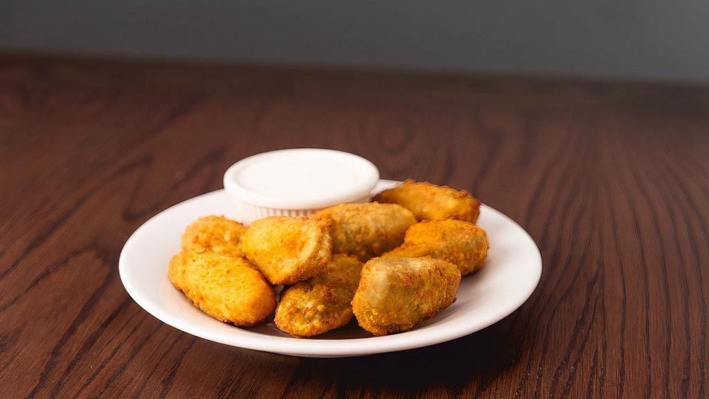 Jalapeno Poppers · Cheddar filled jalapenos served with ranch dressing.