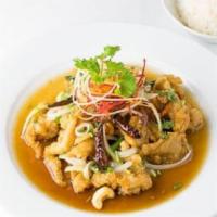 Chicken & Cashew Nut · Crispy chicken, stir-fried with cashew nuts, onions, and roasted chili in a sweet brown sauce.