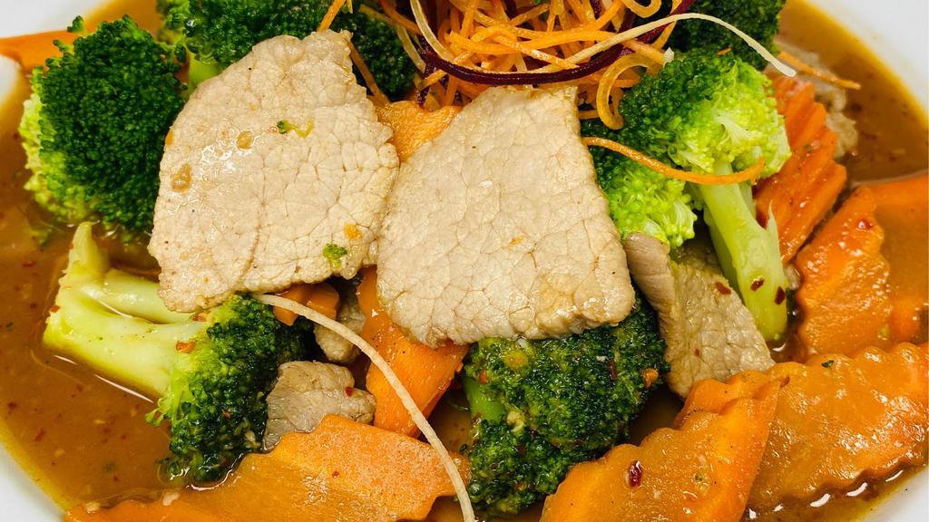 Beef & Broccoli · Stir-fry beef, broccoli and carrots in a light brown sauce. Served with white rice.