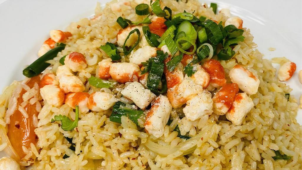 Vegan Crab Fried Rice · Vegan Crab stir-fried fried rice with yellow onion, green onion, tomatoes. (No eggs)
