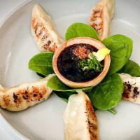 Beef Gyoza · 5 piece pan-seared beef potstickers; side of spicy ponzu sauce