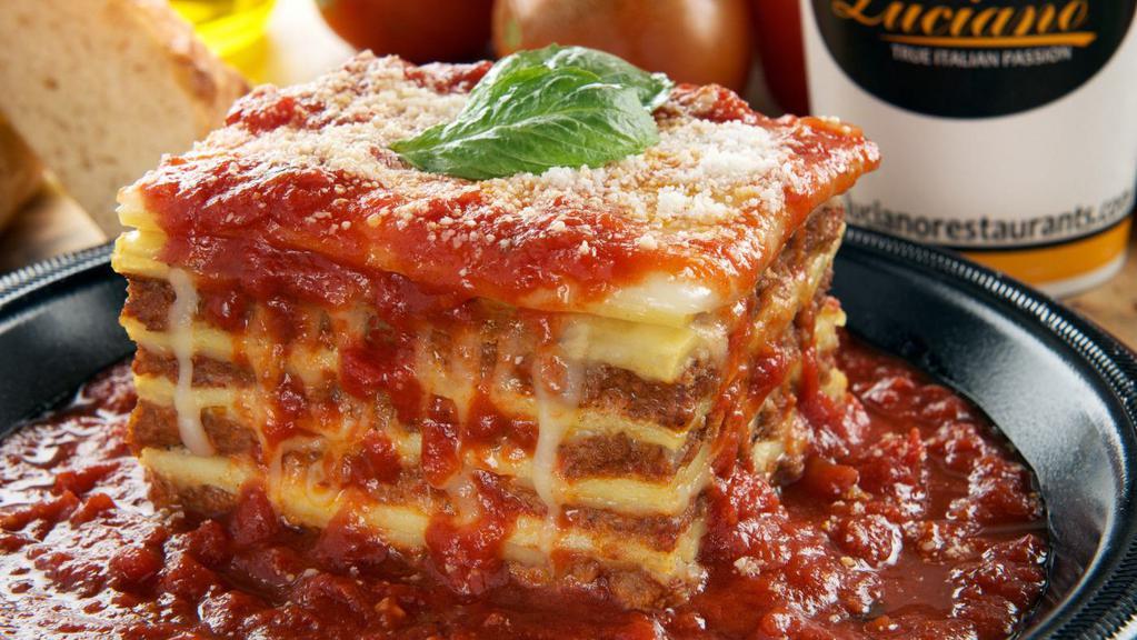 Meat Lasagna · Layers of ribbon pasta, ground beef, ricotta, and mozzarella cheese, and parmesan cheese.