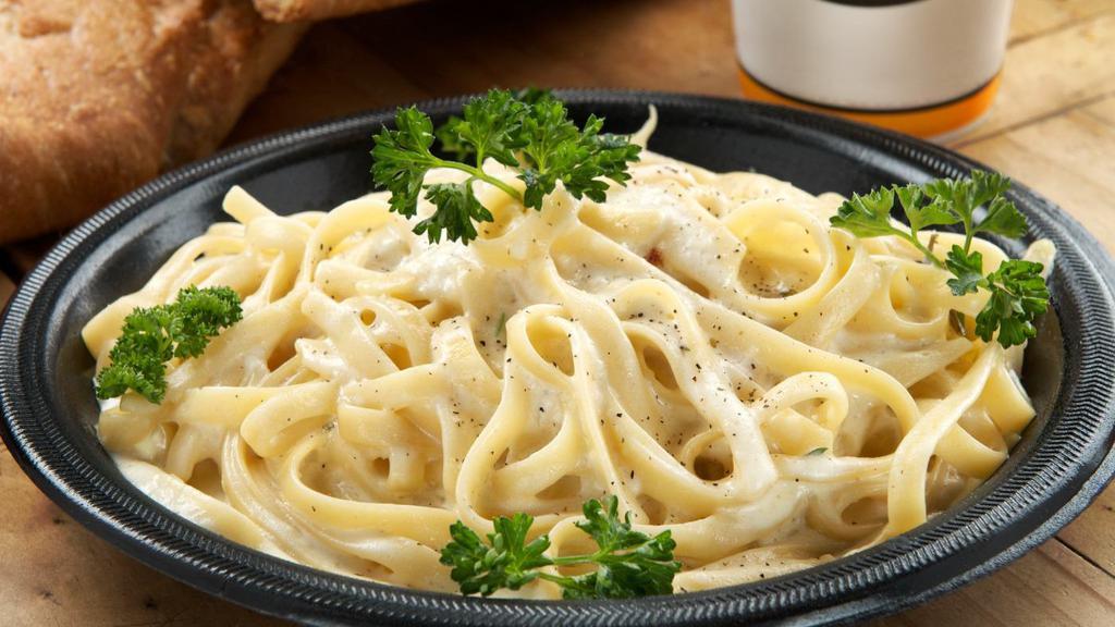 Fettuccine Alfredo With Chicken (Large) · Fettuccine pasta in our own creamy alfredo sauce and grilled chicken.