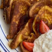 Creme Brulee French Toast · challah soaked in Crème Brulee, baked to perfection topped with whipped cream and fresh stra...