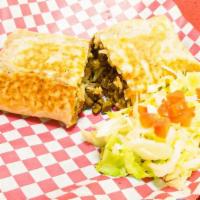 Burrito (Gigante) · Carne, frijoles, arroz, lechuga, tomate, queso, y crema. Extra toppings available.