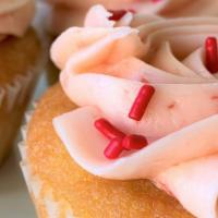 Vanilla-Strawberry Cupcake · Vanilla Rum cupcake frosted with fresh strawberry buttercream