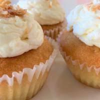 Vanilla-Coconut Cupcake · Vanilla Rum cupcake frosted with a creamy coconut buttercream