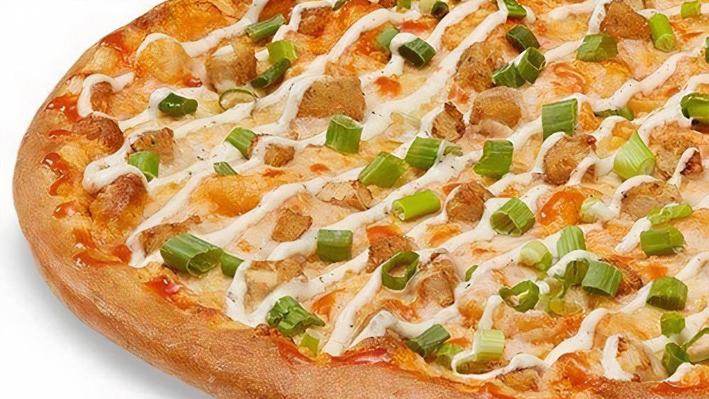 Vegan Buffalo Chicken-Less Topper Pizza · Buffalo sauce, topped  with dairy free mozzarella, plant-based Beyond Chicken, green onions, and drizzled with dairy free ranch.