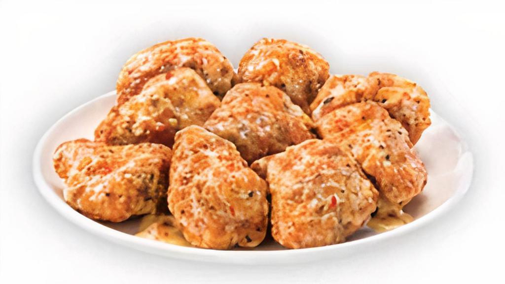 Parmesan Garlic Boneless Wings · Our tender boneless wings; breaded, oven-roasted, and then tossed in parmesan garlic sauce. A classic savory favorite.