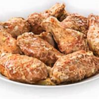 Parmesan Garlic Bone-In Wings · Our traditional bone-in wings oven roasted, and then tossed in parmesan garlic sauce. A clas...