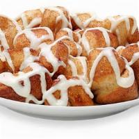 Cinnamon Swirl Monkey Bread · Bite-sized pieces of freshly made dough, sprinkled with cinnamon and sugar, then baked and c...