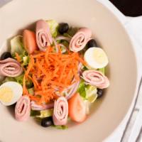 Chef Salad · Romaine lettuce, tomatoes, black olives, onions, shredded carrots, hard boiled egg, Provolon...