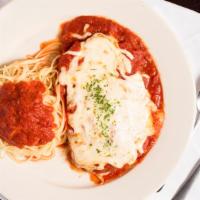 Chicken Parmigiana · Lightly breaded chicken, topped with tomato sauce and Mozzarella cheese served with a side o...