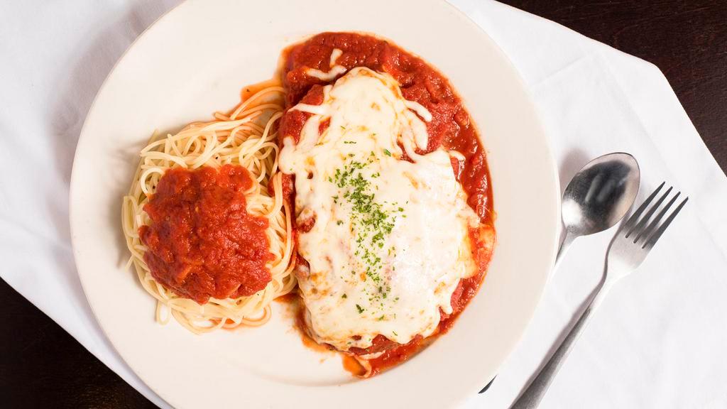 Chicken Parmigiana · Lightly breaded chicken, topped with tomato sauce and Mozzarella cheese served with a side of pasta.