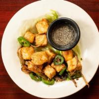 Salt & Pepper · Wok tossed with garlic, jalapeños, white onion, spring onion and house spices.