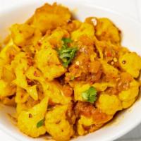 Alu Gobi · Spicy cauliflower and potato cooked in perfection along with ginger and tomato.