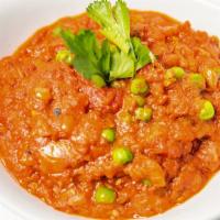 Baingan Bharta · Chargrilled eggplant cooked with simple combination of onions, tomatoes, green peas, and Ind...