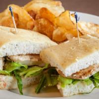 Grilled Chicken Caesar Sandwich · Our famous grilled chicken caesar salad served on focaccia bread (fat-free caesar dressing a...