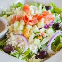 Greek Salad · Greens, tomatoes, red onions, kalamata olive, cucumbers, feta cheese and our special vinaigr...
